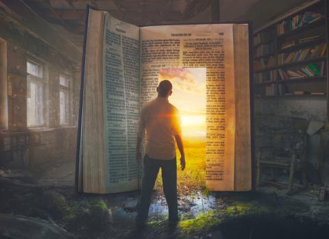 Man looking into a huge Bible like through a doorway by Kevin Carden | Lightstock | Used by Permission